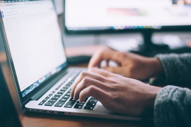 Person viewing document on a laptop